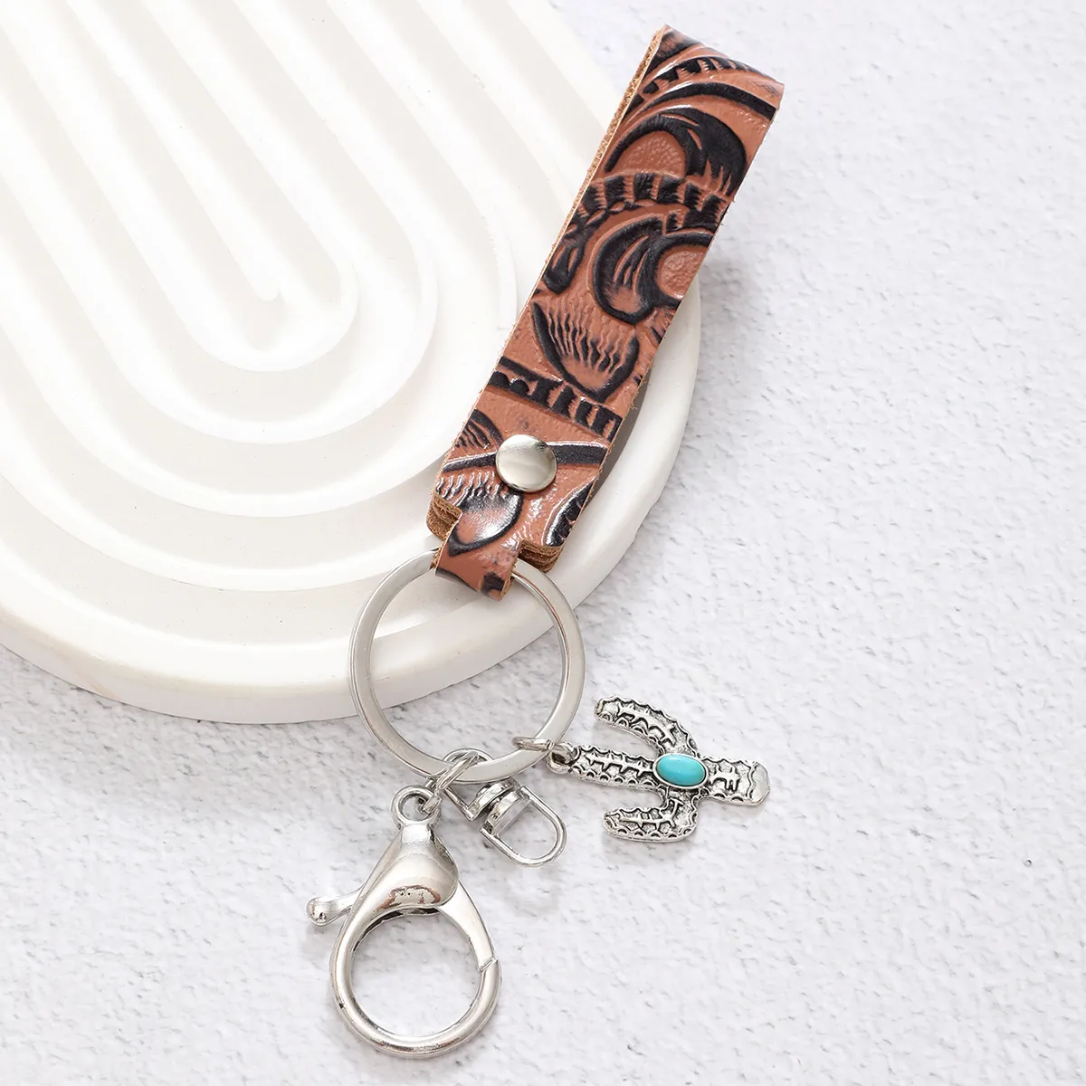 Simple Style Cactus Leaf Dreamcatcher Pu Leather Alloy Turquoise Bag Pendant Keychain display picture 4