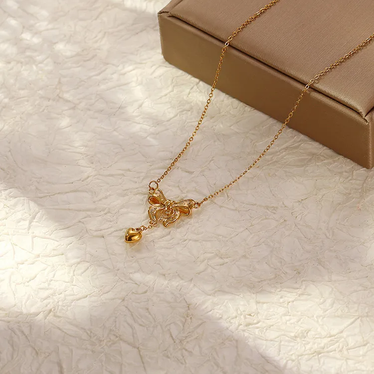 Ig Style Simple Style Bow Knot Stainless Steel Plating Pendant Necklace display picture 1