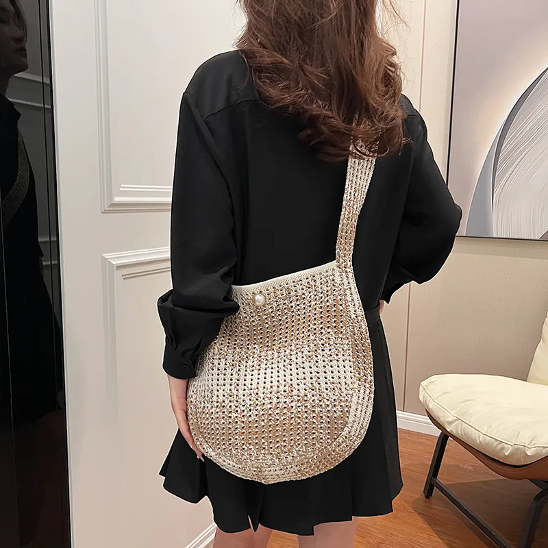 Women's Medium Straw Solid Color Vacation Classic Style Hollow Bucket Magnetic Buckle Crossbody Bag display picture 4