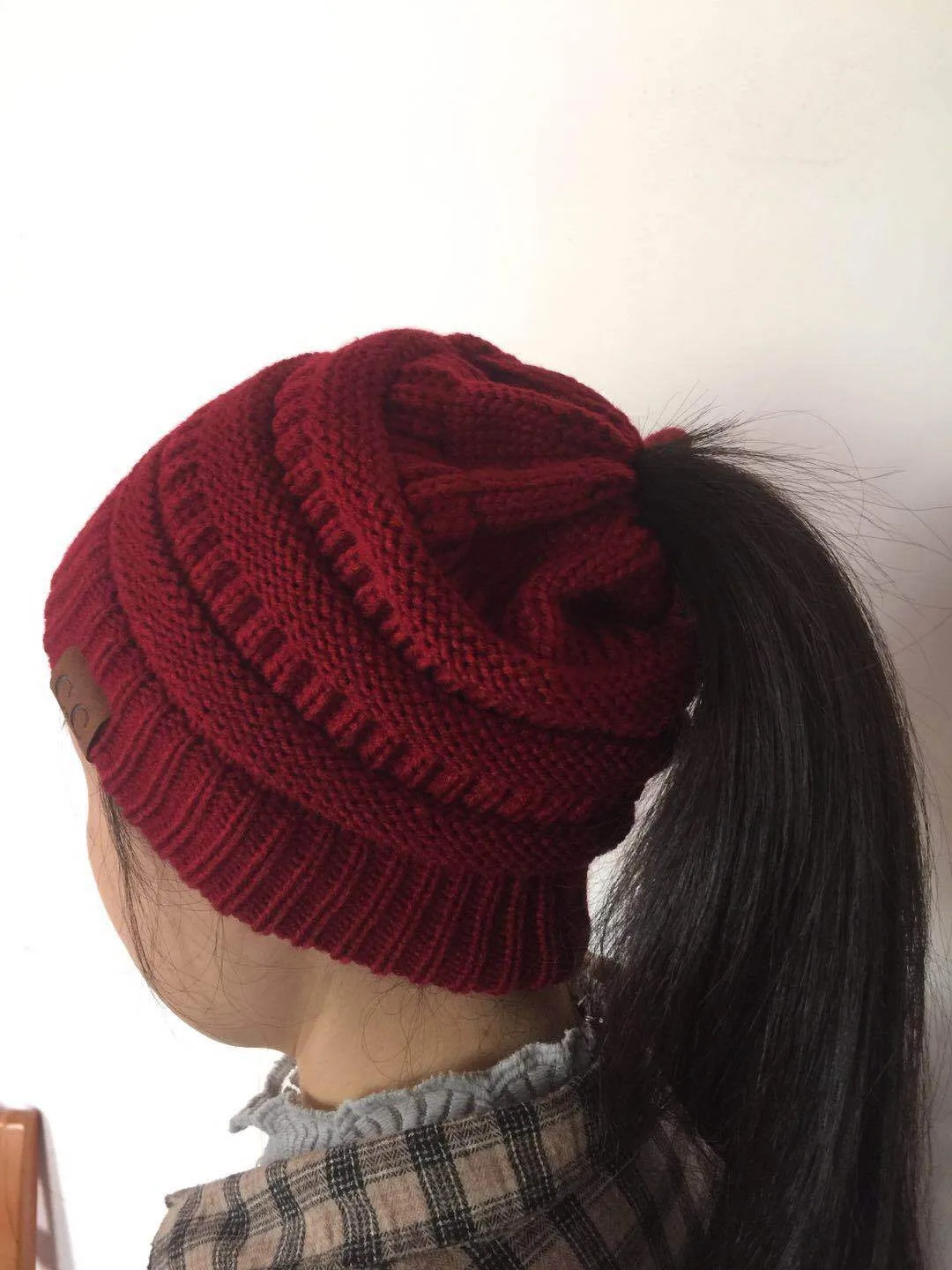 European-style Popular Hat Children's Winter Outdoor Warm Wool Empty Top Ponytail Knit Hat Baotou Hat  Outlet display picture 8