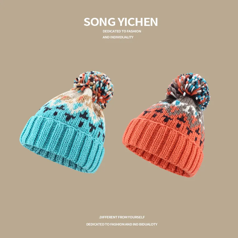 Warm Blue Knitted Hat Female  Fashion Brand Colorful Fur Ball Christmas Hat Autumn And Winter  Ear Protection Wool Hat display picture 1