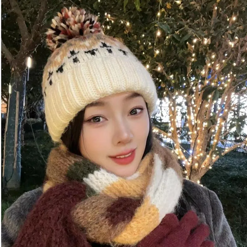 Warm Blue Knitted Hat Female  Fashion Brand Colorful Fur Ball Christmas Hat Autumn And Winter  Ear Protection Wool Hat display picture 12