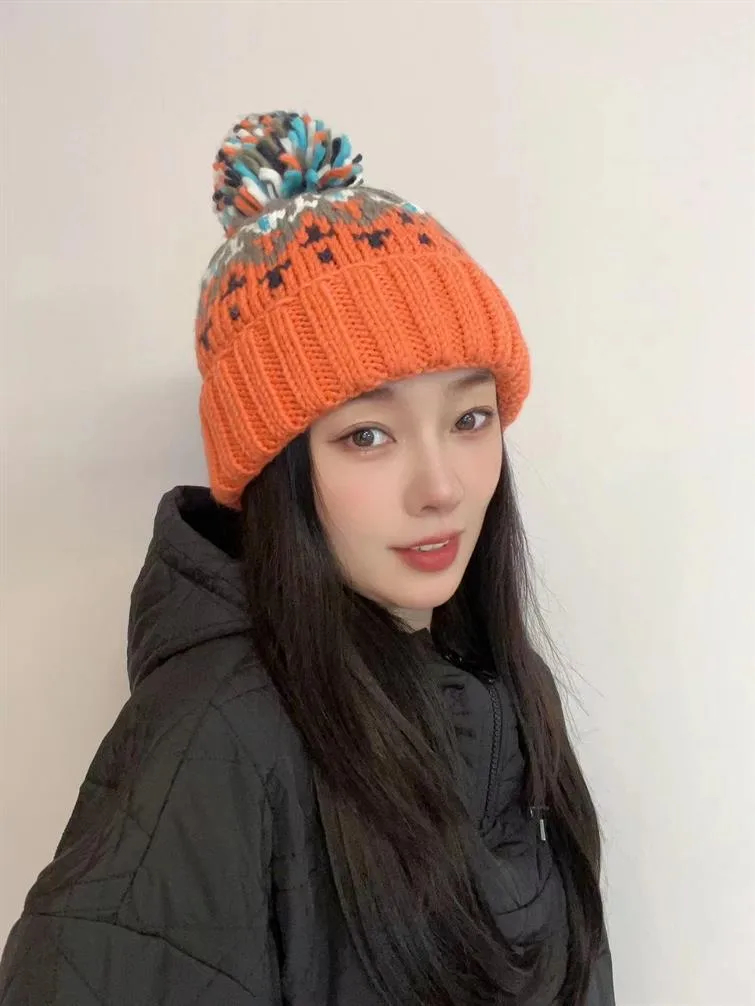 Warm Blue Knitted Hat Female  Fashion Brand Colorful Fur Ball Christmas Hat Autumn And Winter  Ear Protection Wool Hat display picture 24