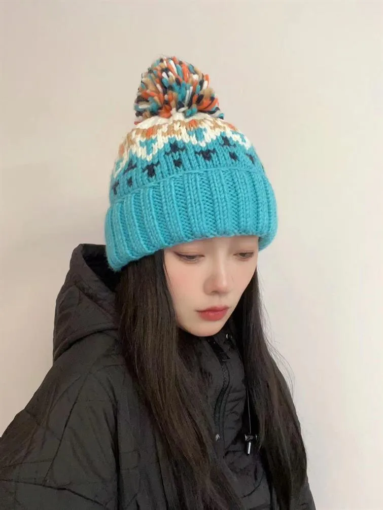 Warm Blue Knitted Hat Female  Fashion Brand Colorful Fur Ball Christmas Hat Autumn And Winter  Ear Protection Wool Hat display picture 25