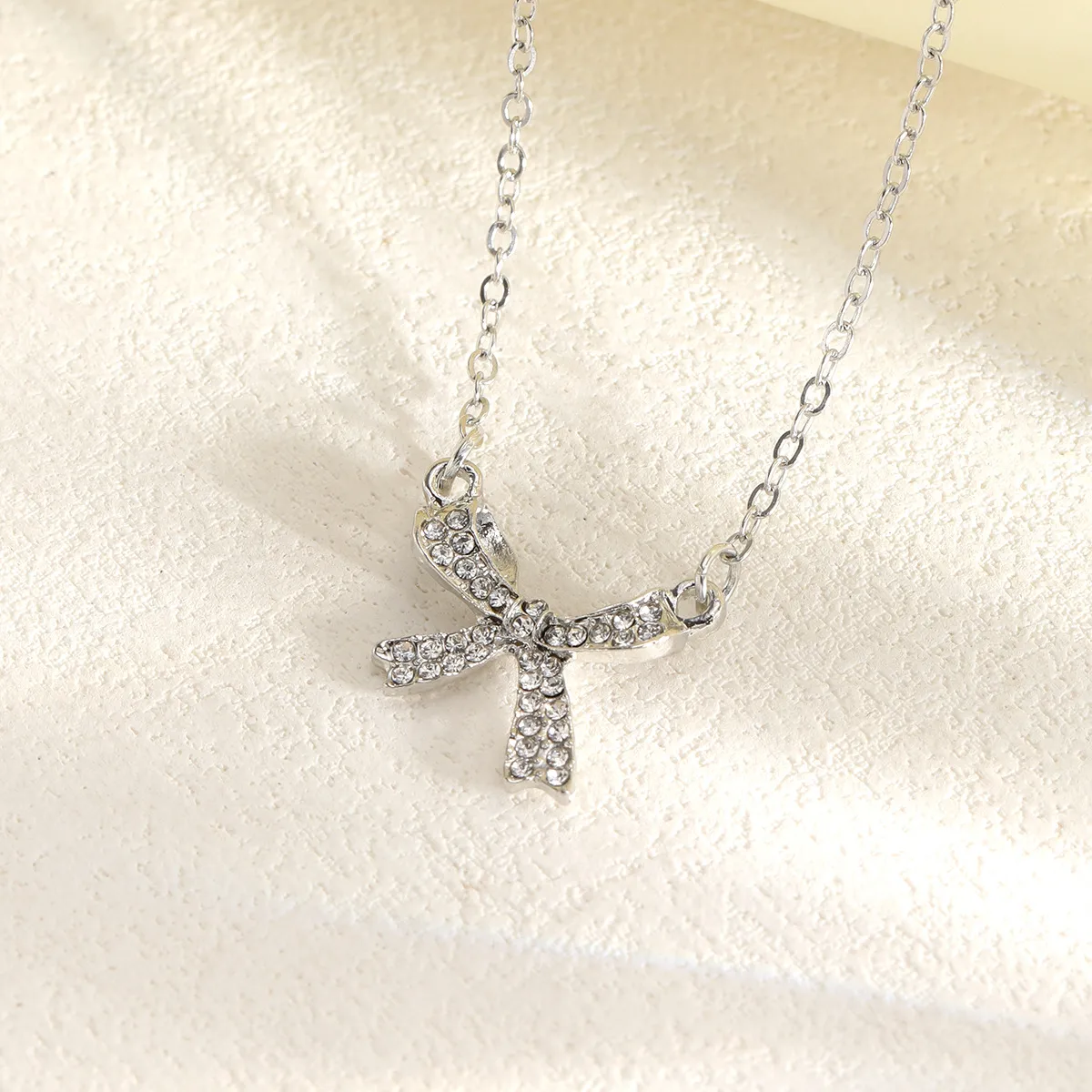 Simple Style Bow Knot Alloy Cable Chain Pendant Necklaces Wholesale display picture 4