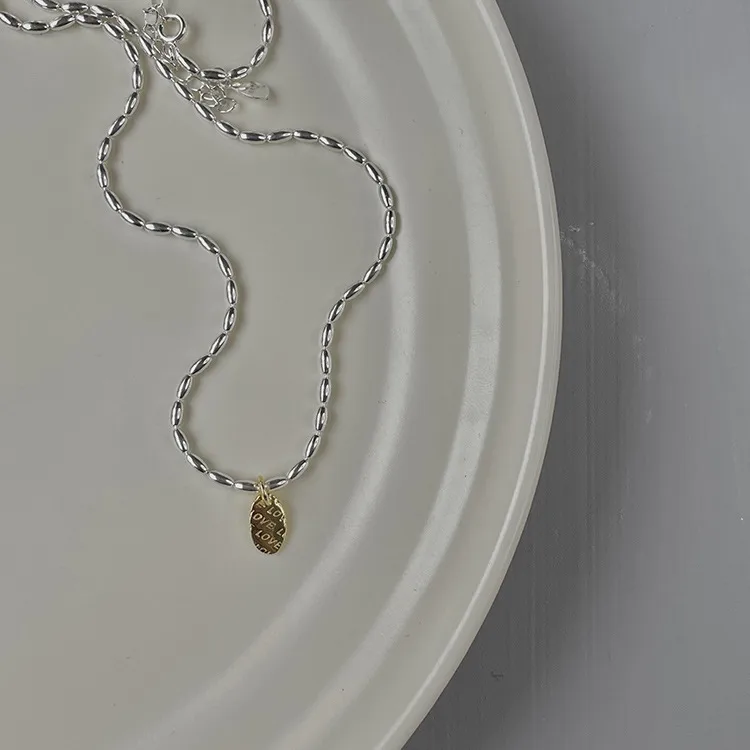 Gold And Silver Love Necklace Rice Olive Beads 925 Sterling Silver Niche Design Clavicle Chain Women's High-end Silver Ornaments display picture 17