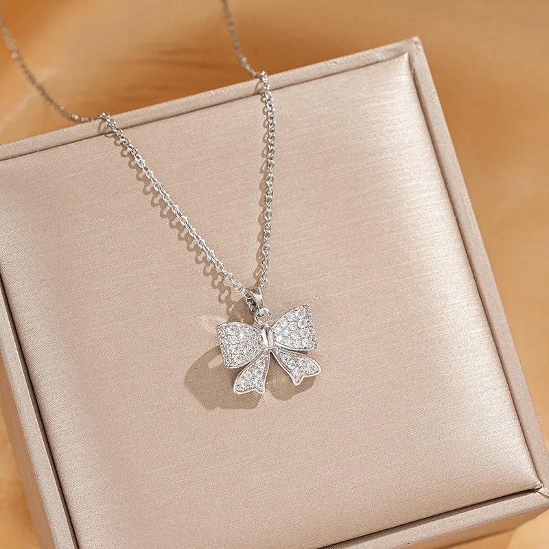 Vacation Classic Style Bow Knot Titanium Steel Copper Bowknot Inlaid Zircon Women's Pendant Necklace display picture 3