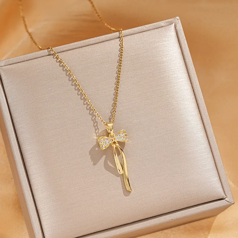 Vacation Classic Style Bow Knot Titanium Steel Copper Bowknot Inlaid Zircon Women's Pendant Necklace display picture 2