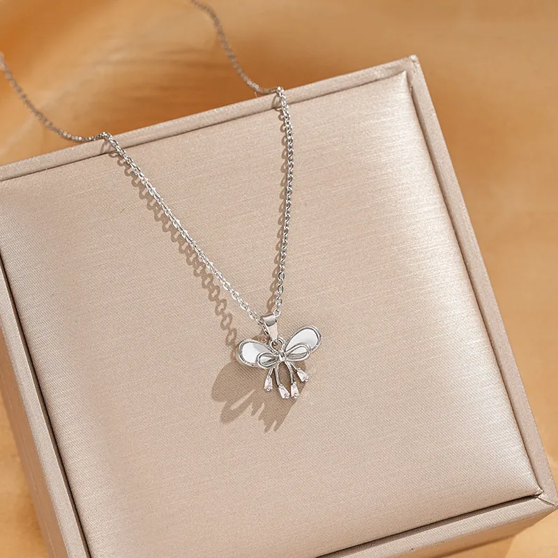 Vacation Classic Style Bow Knot Titanium Steel Copper Bowknot Inlaid Zircon Women's Pendant Necklace display picture 5