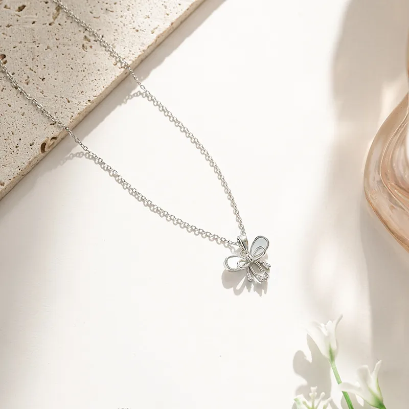 Vacation Classic Style Bow Knot Titanium Steel Copper Bowknot Inlaid Zircon Women's Pendant Necklace display picture 9