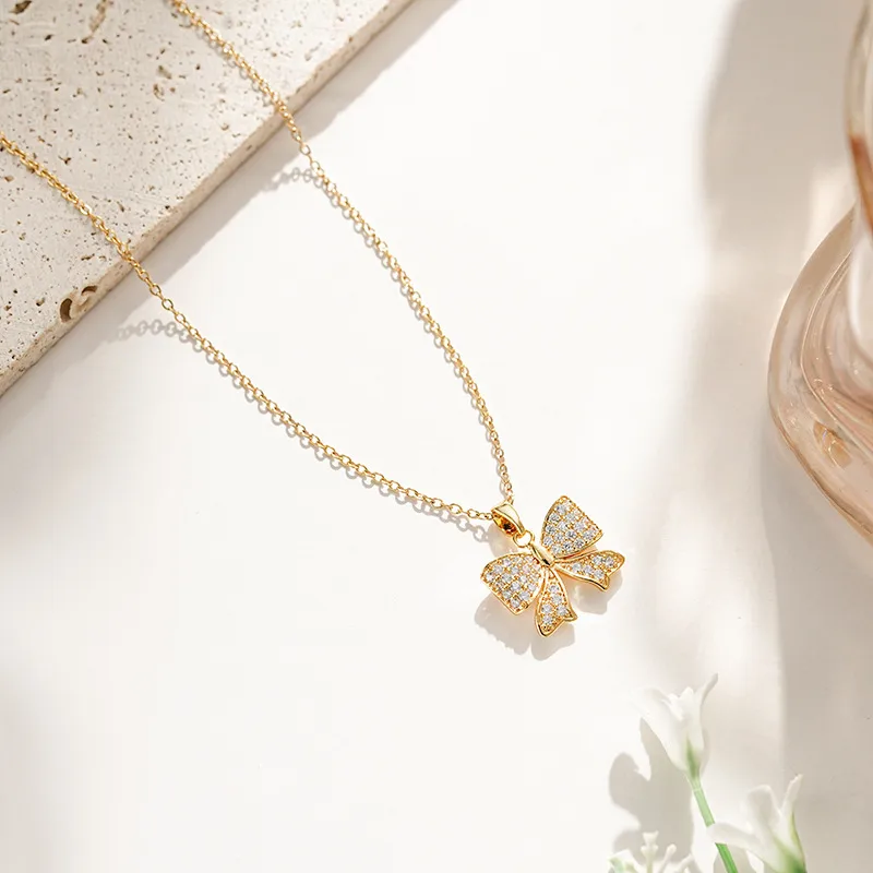 Vacation Classic Style Bow Knot Titanium Steel Copper Bowknot Inlaid Zircon Women's Pendant Necklace display picture 10