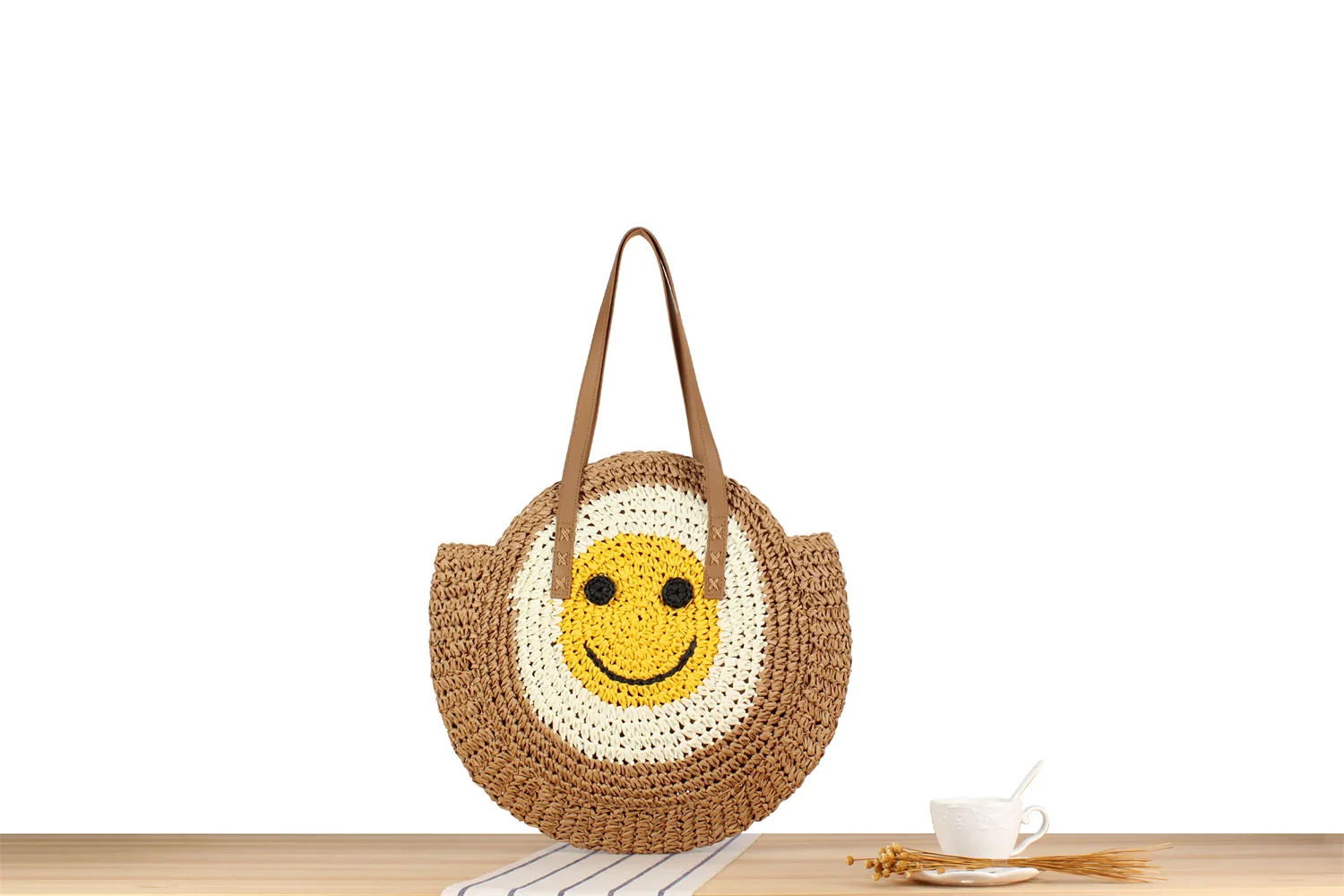 A Generation Of New Simple Smiley Face Shoulder Straw Bag Paper Rope Hollow Hand Woven Bag Large Capacity Disc Bag display picture 1