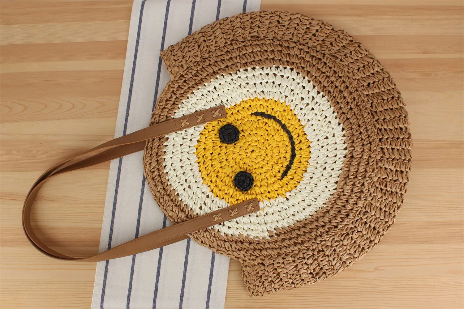 A Generation Of New Simple Smiley Face Shoulder Straw Bag Paper Rope Hollow Hand Woven Bag Large Capacity Disc Bag display picture 6