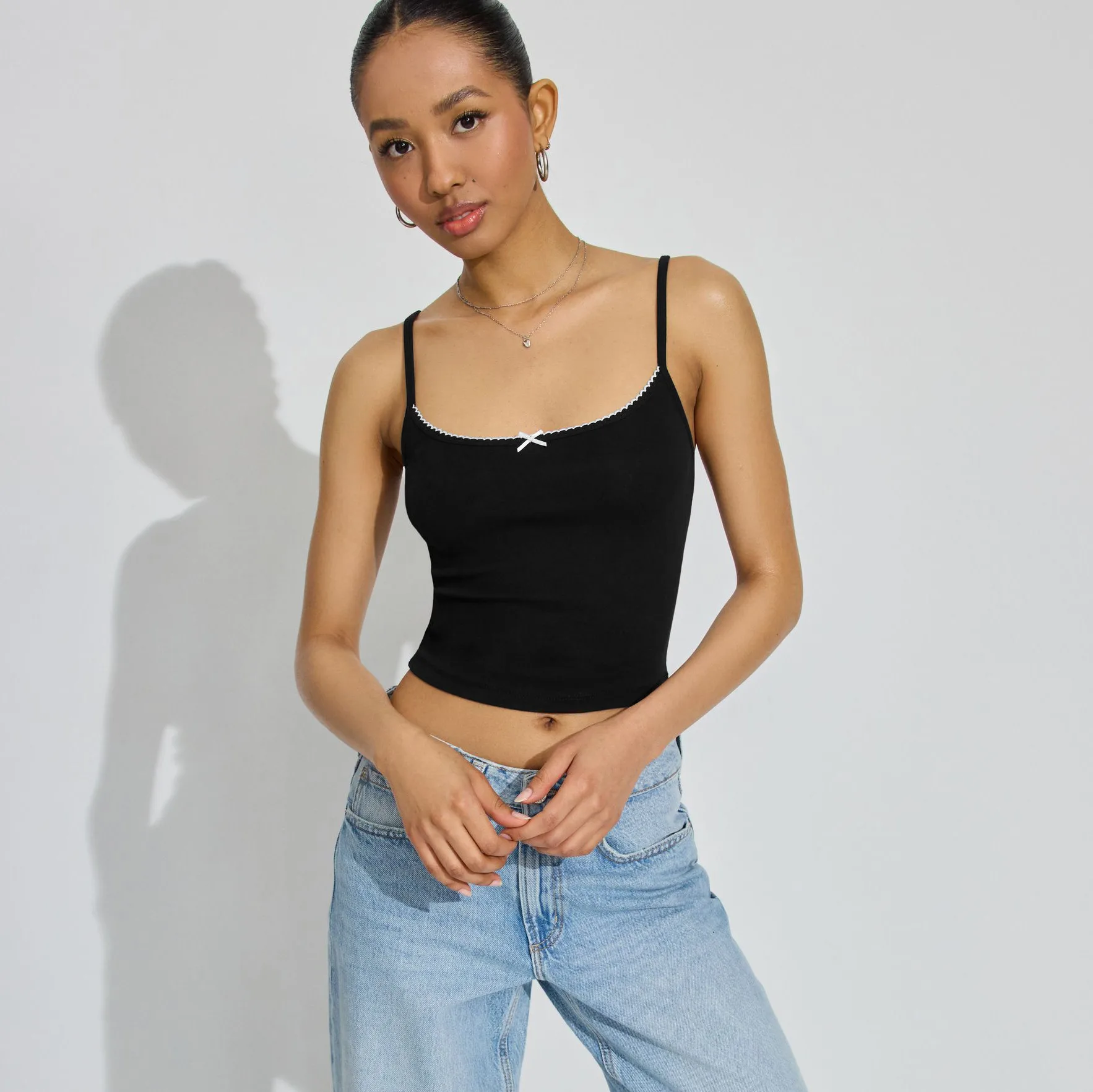 Spring And Summer  Women's Bow Decoration Sexy Low Collar Backless Solid Color Sling Navel Ins Style Short Vest display picture 13