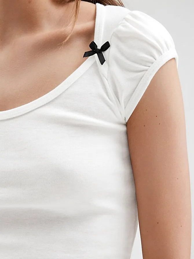 Designed   Spring And Summer New Fashion Trend Solid Color Shoulder T-shirt Bow Decoration Slim Top display picture 7