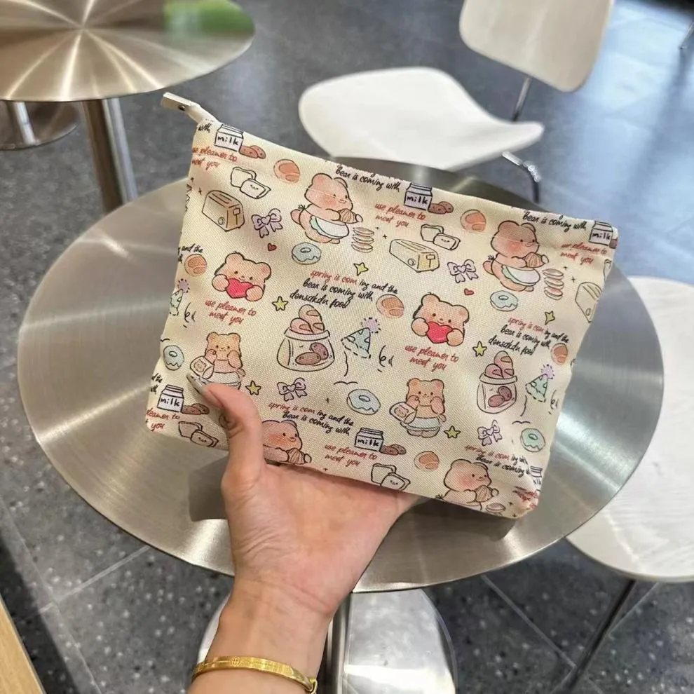 New Ins Cream Cosmetic Bag Large Capacity Portable Small Items Buggy Bag Travel Earphone Bag Coin Purse display picture 1