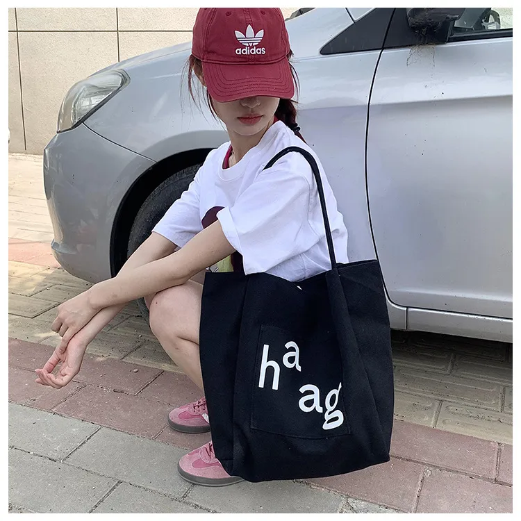 Letter Printed Canvas Women's Tote Bag Literary Style Large Capacity Student Schoolbag 2024 New Fashion Shoulder Bag display picture 11