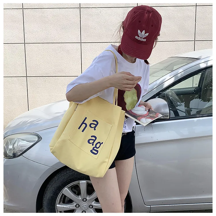 Letter Printed Canvas Women's Tote Bag Literary Style Large Capacity Student Schoolbag 2024 New Fashion Shoulder Bag display picture 17