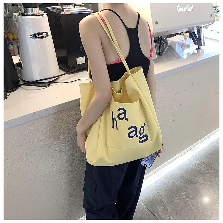 Letter Printed Canvas Women's Tote Bag Literary Style Large Capacity Student Schoolbag 2024 New Fashion Shoulder Bag display picture 19