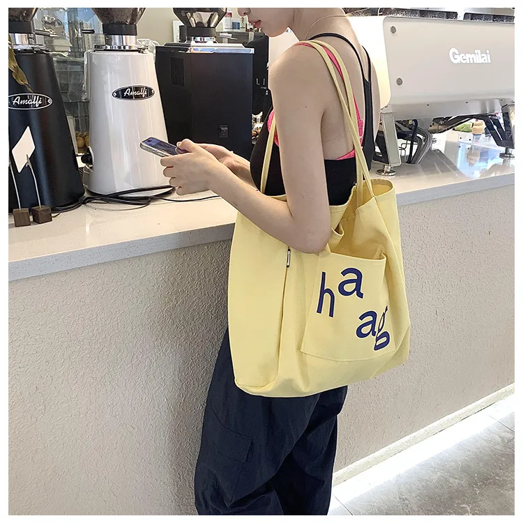 Letter Printed Canvas Women's Tote Bag Literary Style Large Capacity Student Schoolbag 2024 New Fashion Shoulder Bag display picture 20