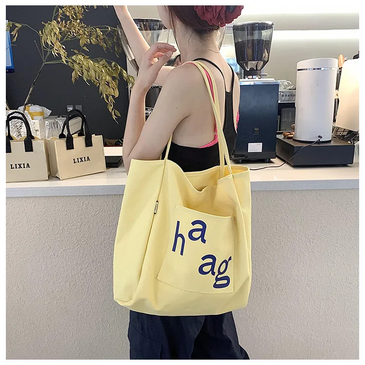 Letter Printed Canvas Women's Tote Bag Literary Style Large Capacity Student Schoolbag 2024 New Fashion Shoulder Bag display picture 21