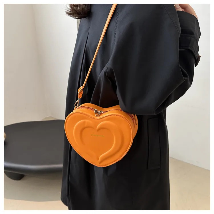 Fashion Heart-Shaped Small Bag  Autumn New Stylish Indented Crossbody Bag Ins Niche Design Shoulder Small Bag display picture 3