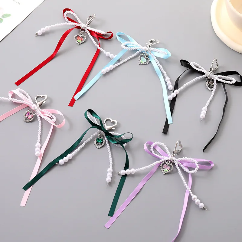 1 Piece Cute Modern Style Classic Style Heart Shape Bow Knot Imitation Pearl Alloy Women's Heart Clasp Closure Bag Pendant Keychain display picture 1
