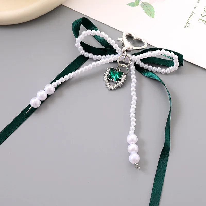 1 Piece Cute Modern Style Classic Style Heart Shape Bow Knot Imitation Pearl Alloy Women's Heart Clasp Closure Bag Pendant Keychain display picture 4
