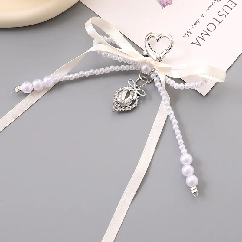 1 Piece Cute Modern Style Classic Style Heart Shape Bow Knot Imitation Pearl Alloy Women's Heart Clasp Closure Bag Pendant Keychain display picture 3