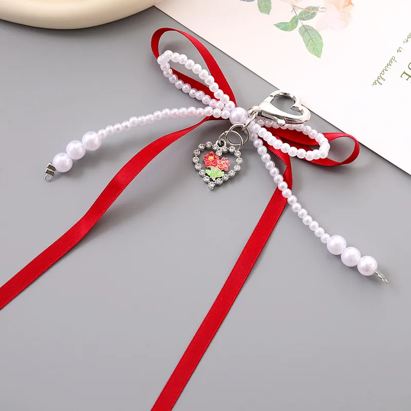 1 Piece Cute Modern Style Classic Style Heart Shape Bow Knot Imitation Pearl Alloy Women's Heart Clasp Closure Bag Pendant Keychain display picture 5