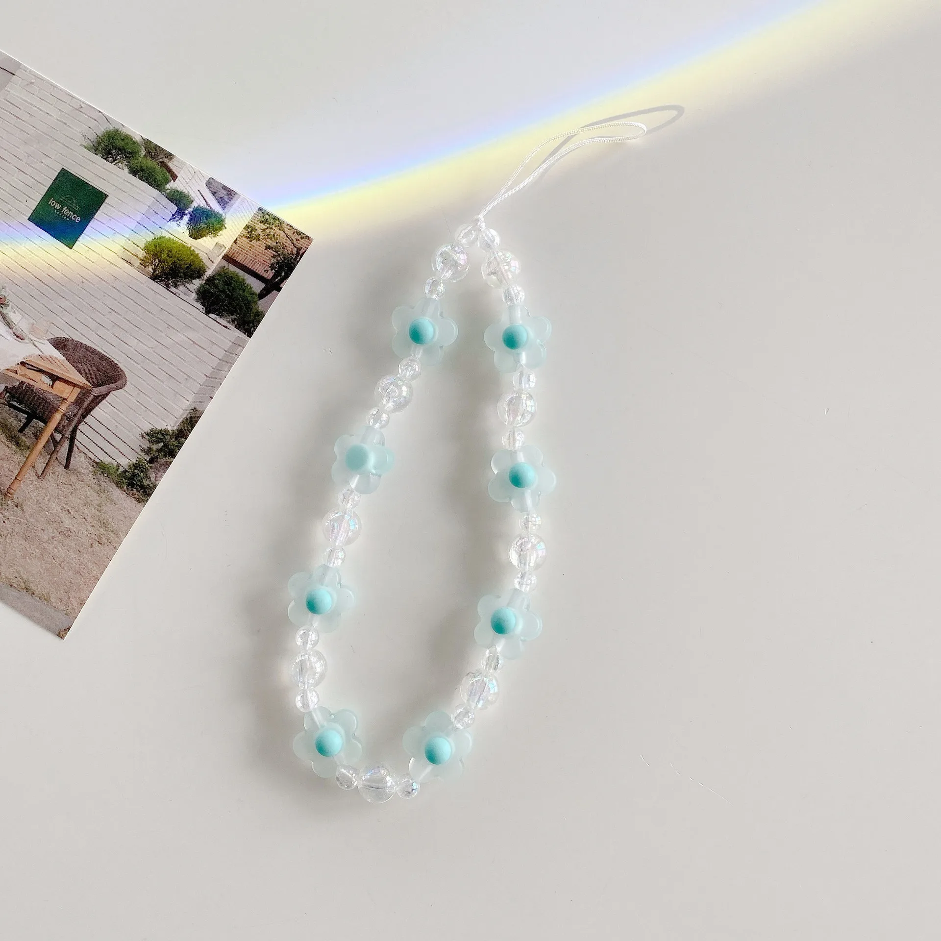 New Blue Flower Mobile Phone Charm Short Pendant Ins Lanyard Female Smiling Face Bracelet Love PVC Plastic Buckle display picture 3
