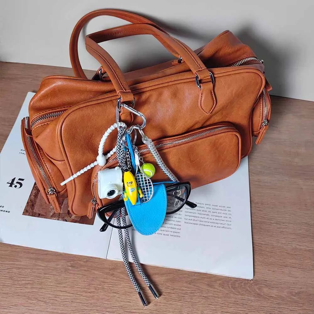 Blue Magnetic Eyeglass Clip Keychain Banana Man Tennis Camera Bag Storage Pendant American Style Mixed Material Keychain Accessory display picture 2