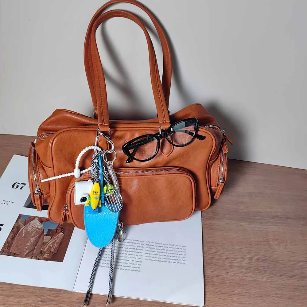 Blue Magnetic Eyeglass Clip Keychain Banana Man Tennis Camera Bag Storage Pendant American Style Mixed Material Keychain Accessory display picture 3