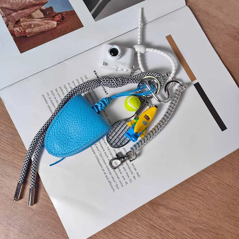 Blue Magnetic Eyeglass Clip Keychain Banana Man Tennis Camera Bag Storage Pendant American Style Mixed Material Keychain Accessory display picture 9