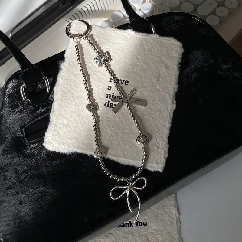 Silver Butterfly Knot Beaded Phone Chain New Ins Girl Ccd Lanyard Bag Pendant Cool Original Design Minimalist Style display picture 1