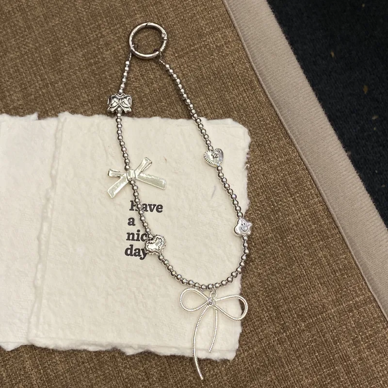 Silver Butterfly Knot Beaded Phone Chain New Ins Girl Ccd Lanyard Bag Pendant Cool Original Design Minimalist Style display picture 7