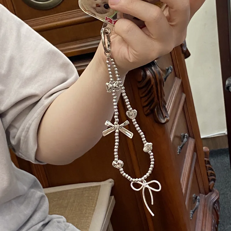Silver Butterfly Knot Beaded Phone Chain New Ins Girl Ccd Lanyard Bag Pendant Cool Original Design Minimalist Style display picture 9