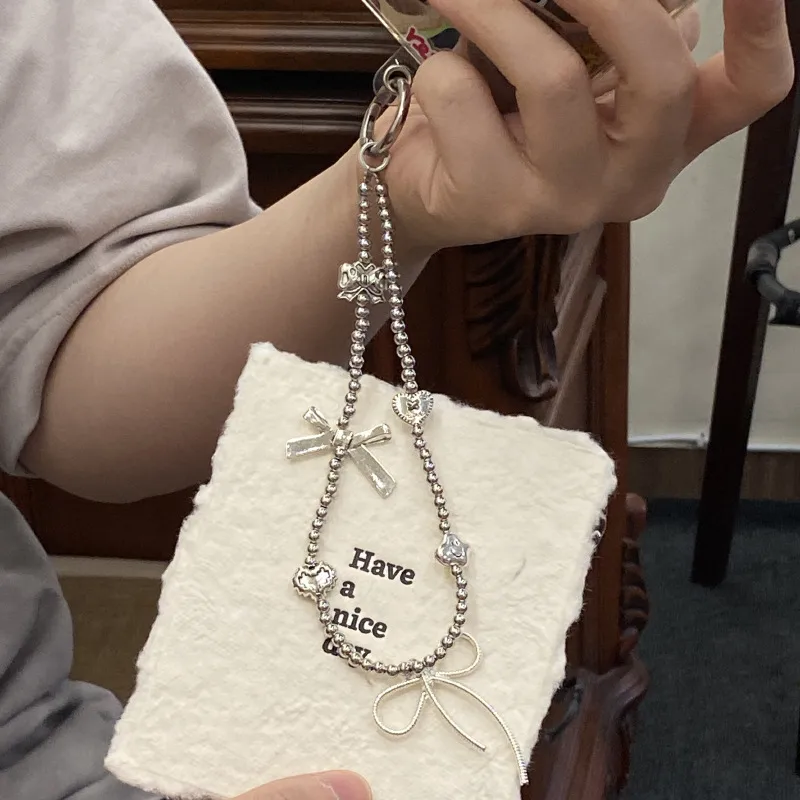 Silver Butterfly Knot Beaded Phone Chain New Ins Girl Ccd Lanyard Bag Pendant Cool Original Design Minimalist Style display picture 10