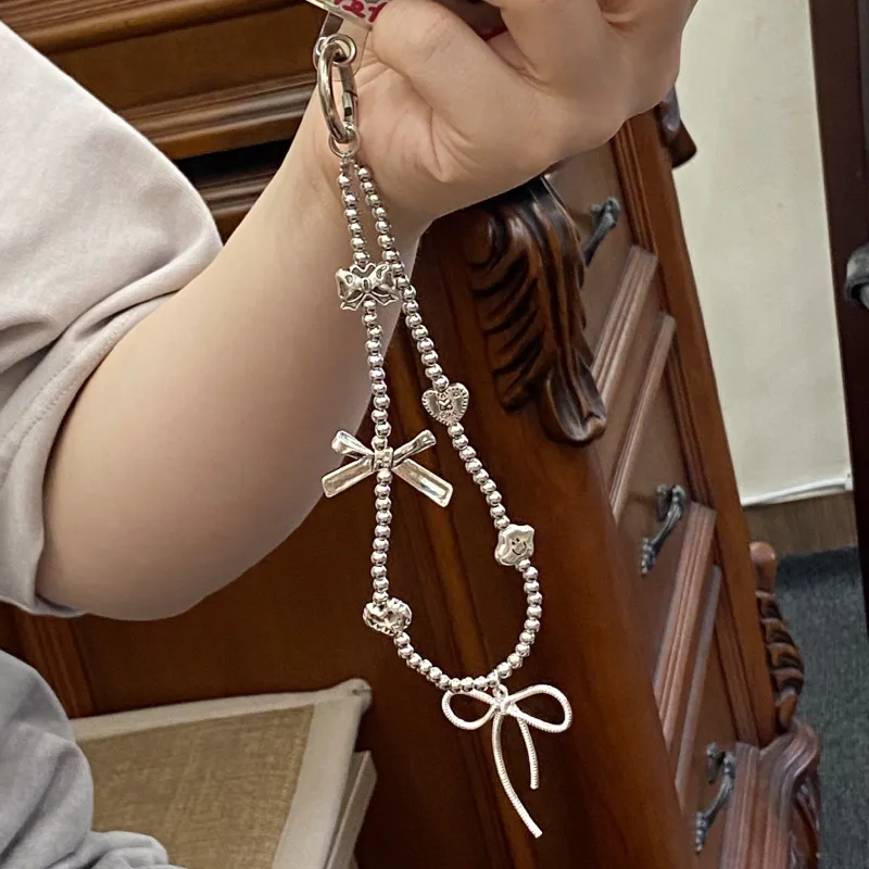 Silver Butterfly Knot Beaded Phone Chain New Ins Girl Ccd Lanyard Bag Pendant Cool Original Design Minimalist Style display picture 12