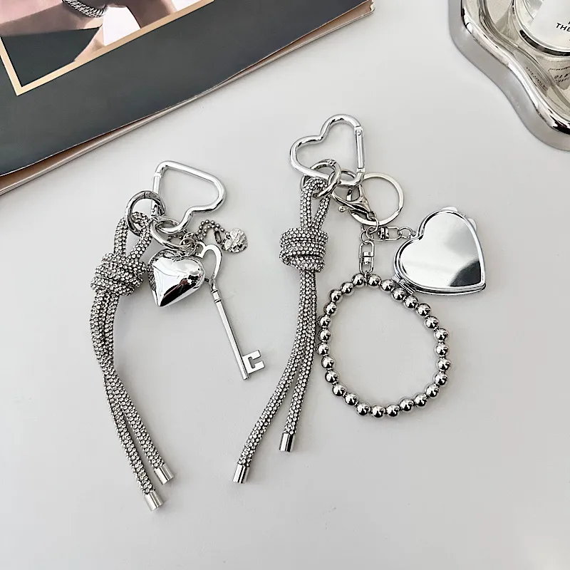 Silver Heart-Shaped Bag Accessories Simple Style Braided Rope Keychain Metal Texture Acrylic Material Super Lightweight display picture 1