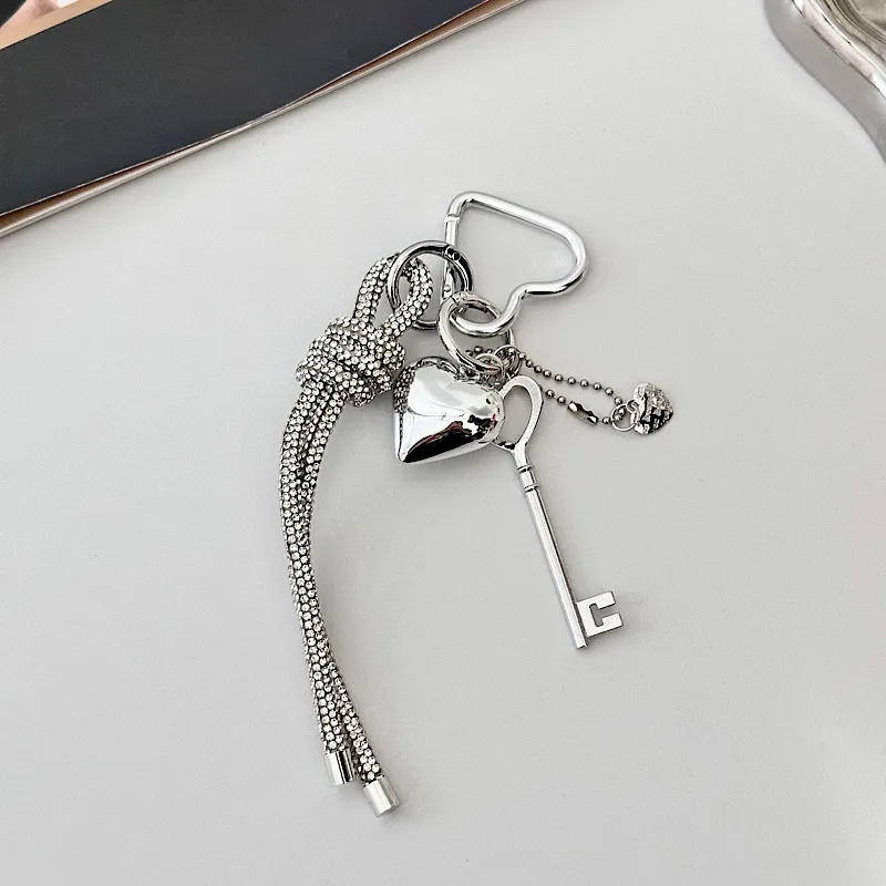 Silver Heart-Shaped Bag Accessories Simple Style Braided Rope Keychain Metal Texture Acrylic Material Super Lightweight display picture 5