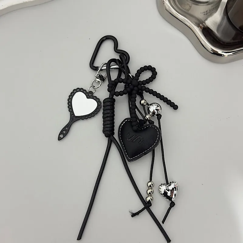 Creative Black Rope Silver Heart-Shaped Black Bead Bow Leather Pendant Suitable For Mobile Phone Bag Keychain Accessories display picture 3