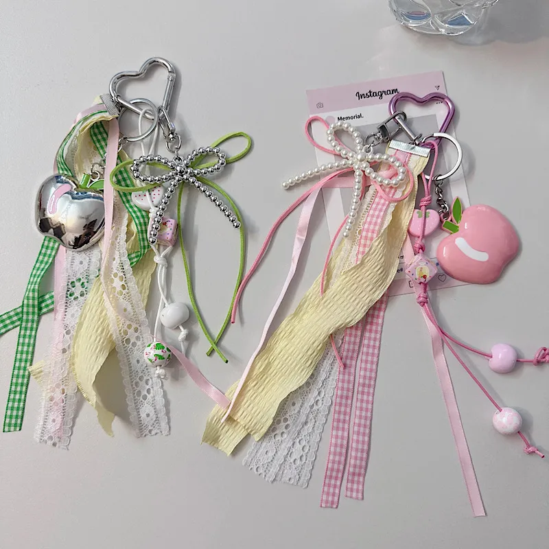 Creative Apple Bow Lace Keychain Pearl Earphone Sleeves Lanyard Backpack Accessories New Acrylic Sweet Pattern display picture 1