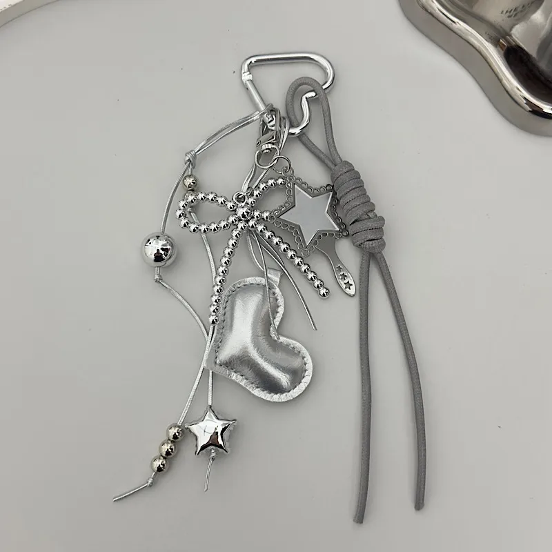 Creative Black Rope Silver Heart-Shaped Black Bead Bow Leather Pendant Suitable For Mobile Phone Bag Keychain Accessories display picture 4
