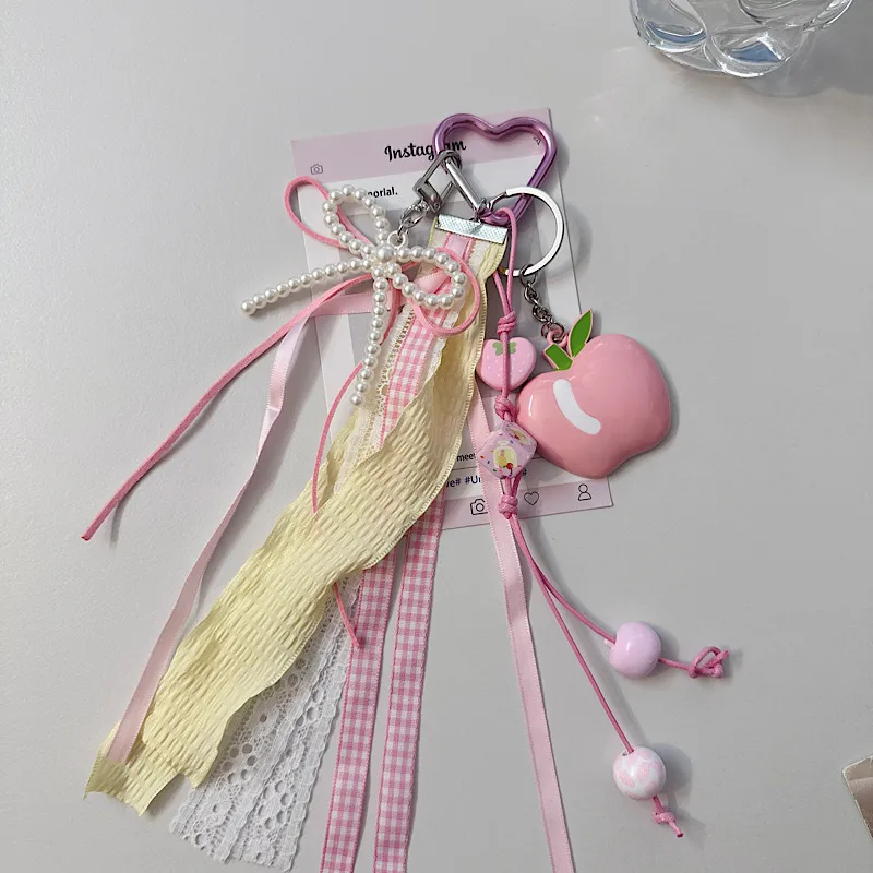Creative Apple Bow Lace Keychain Pearl Earphone Sleeves Lanyard Backpack Accessories New Acrylic Sweet Pattern display picture 3