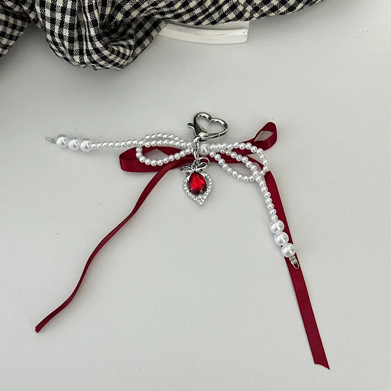 Elegant Silk Ribbon Pearl Bow Pendant Ins Style Heart-Shaped Keychain AirPods Accessory Bag Decoration display picture 4