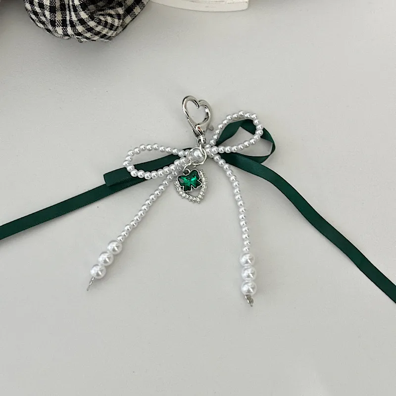 Elegant Silk Ribbon Pearl Bow Pendant Ins Style Heart-Shaped Keychain AirPods Accessory Bag Decoration display picture 6