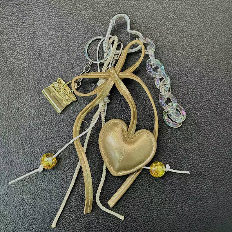 Mini Gold Leather Heart-Shaped Keychain Bag Accessories Women's Simple Style PVC Printed Dark Series Fashion Accessories display picture 4