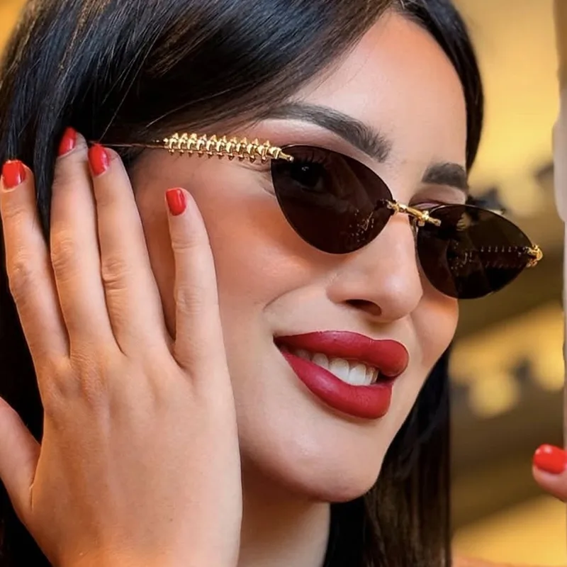 Fashion Cat Eye Sunglasses Unisex Rimless Cutting Edge Triangle Sun Protection High-End Polarized Lens Glasses display picture 4