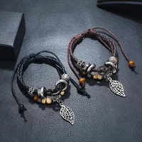 Korean Version Of Imitation Cowhide Bracelet Simple Wild Alloy Leaf Pendant Woven Leather Bracelet main image 2